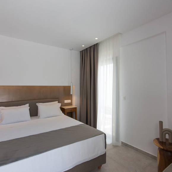 Nami Hotel Suites Deluxe Room bedroom and double bed