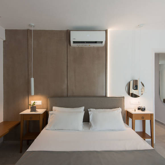 Nami Hotel Suites Suite double bed with bedside tables and amenities
