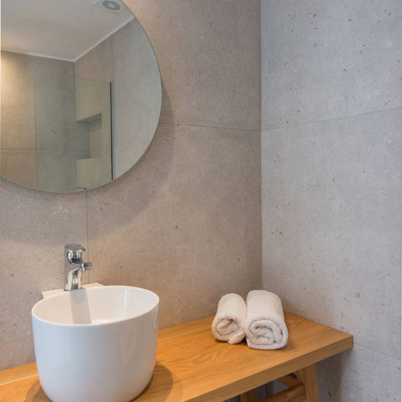 Nami Hotel Suites Deluxe Room bathroom washbasin and amenities