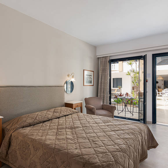 Nami Hotel Suites Standard Room double bed with terrace view