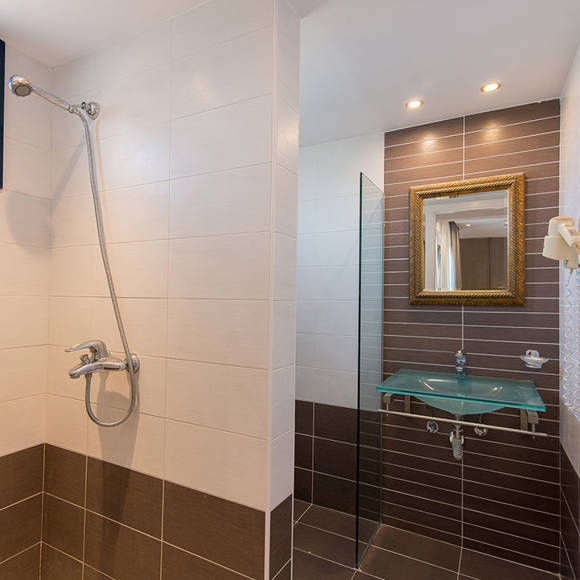 Nami Hotel Suites Deluxe Room bathroom and shower