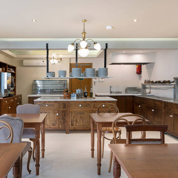 Nami Hotel Suites Restaurant tables and the buffet area in the background