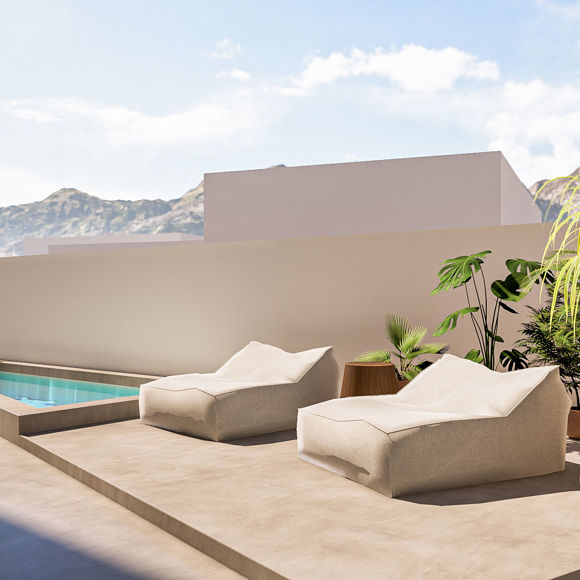 Nami Hotel Suites pool with sunbeds and flower pots