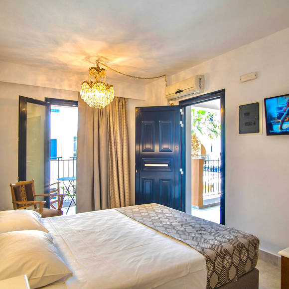 Nami Hotel Suites Double Superior Room bedroom with balcony view