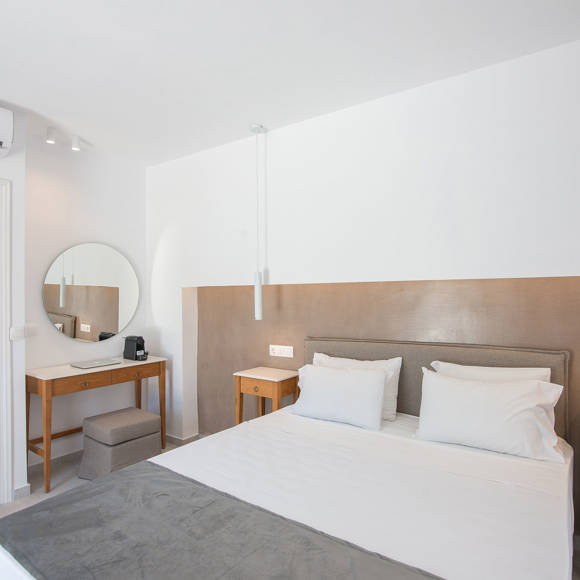 Nami Hotel Suites Deluxe Room bedroom and bathroom door