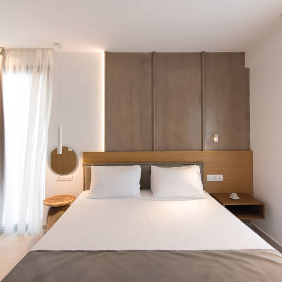 Nami Hotel Suites Deluxe Room decorated double bed