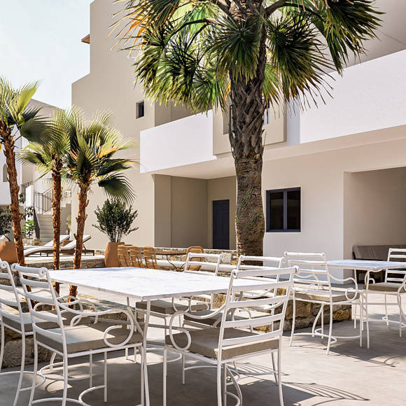 Nami Hotel Suites outdoor area with tables and chairs