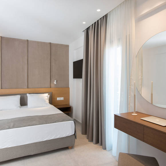 Nami Hotel Suites Deluxe Room bedroom and amenities