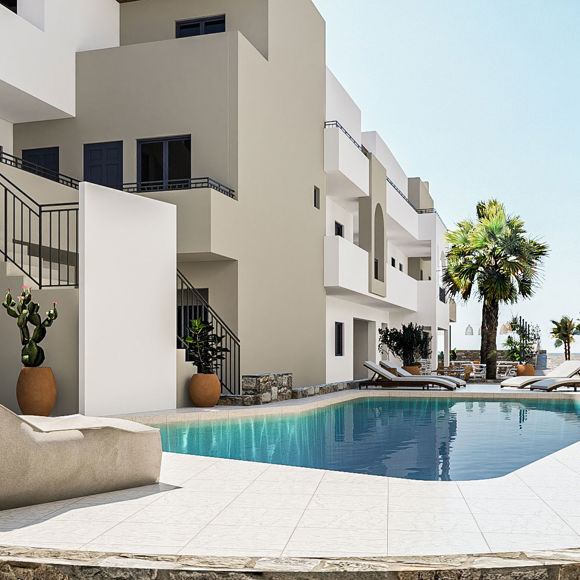 Nami Hotel Suites pool with sunbeds and flower pots